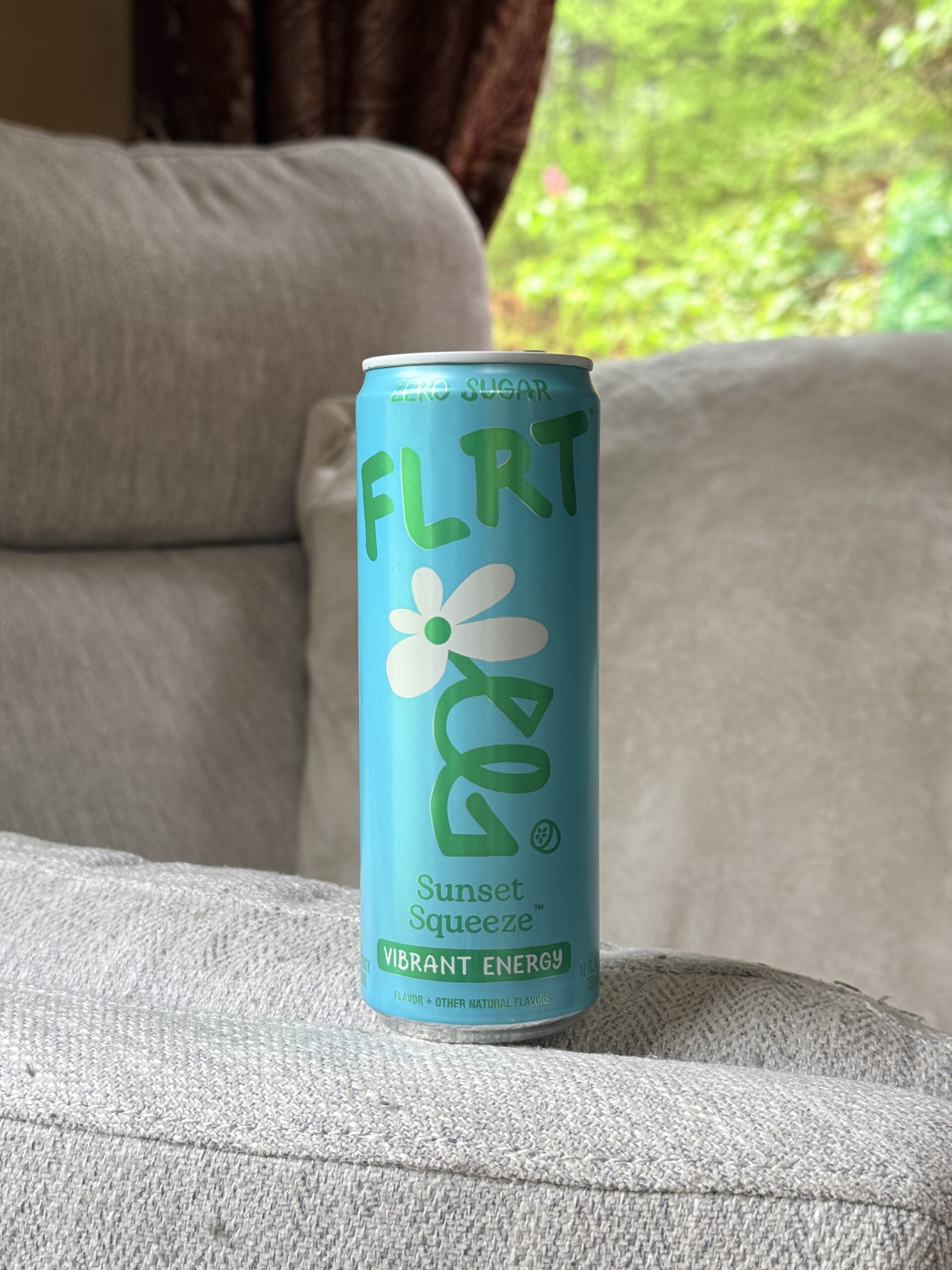 A can of FLRT Energy Drink Sunset Squeeze